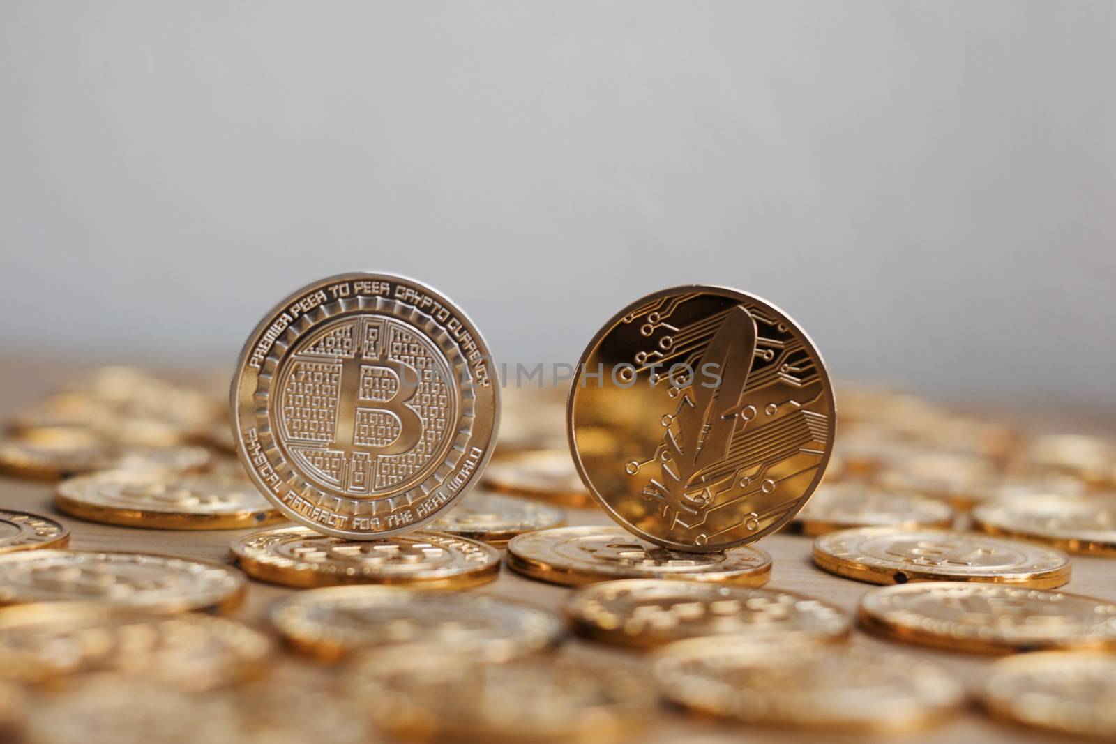 Digital currency physical bitcoin coin. Gold background coins concept.
