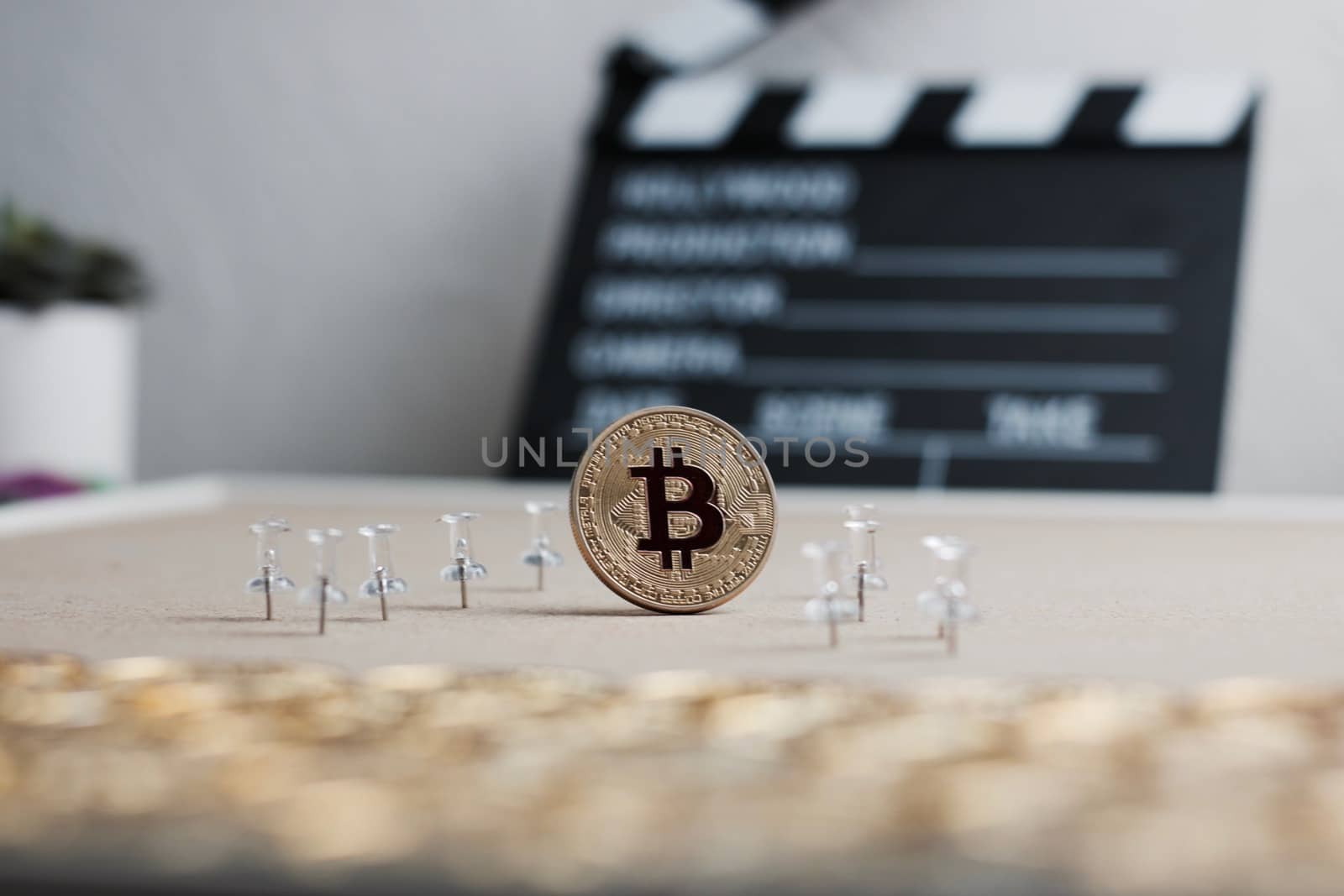 Digital currency physical metal bitcoin coin. Cryptocurrency cinema concept.