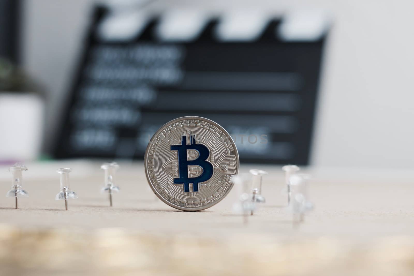 Digital currency physical metal bitcoin coin. Cryptocurrency cinema concept.