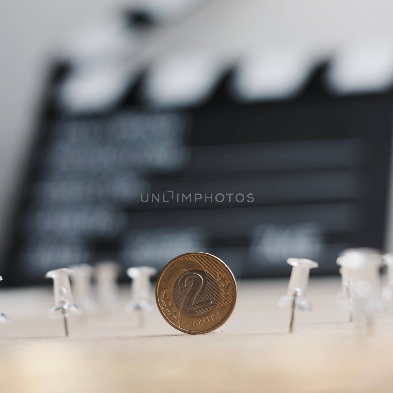 Physical polish coin near cinema board. Polish money lifestyle concept.