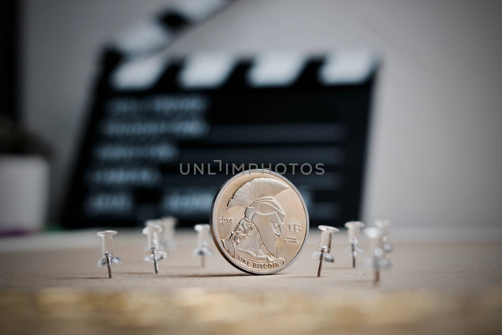 Digital currency physical metal bitcoin coin. Cryptocurrency cinema concept.