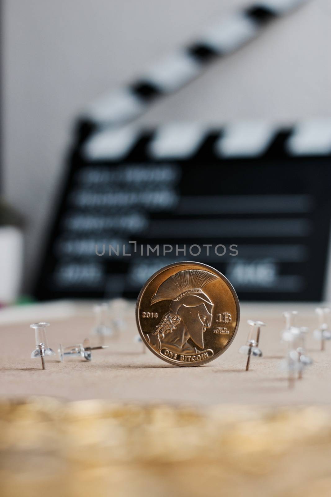 Digital currency physical metal bitcoin coin. Cryptocurrency cinema concept.