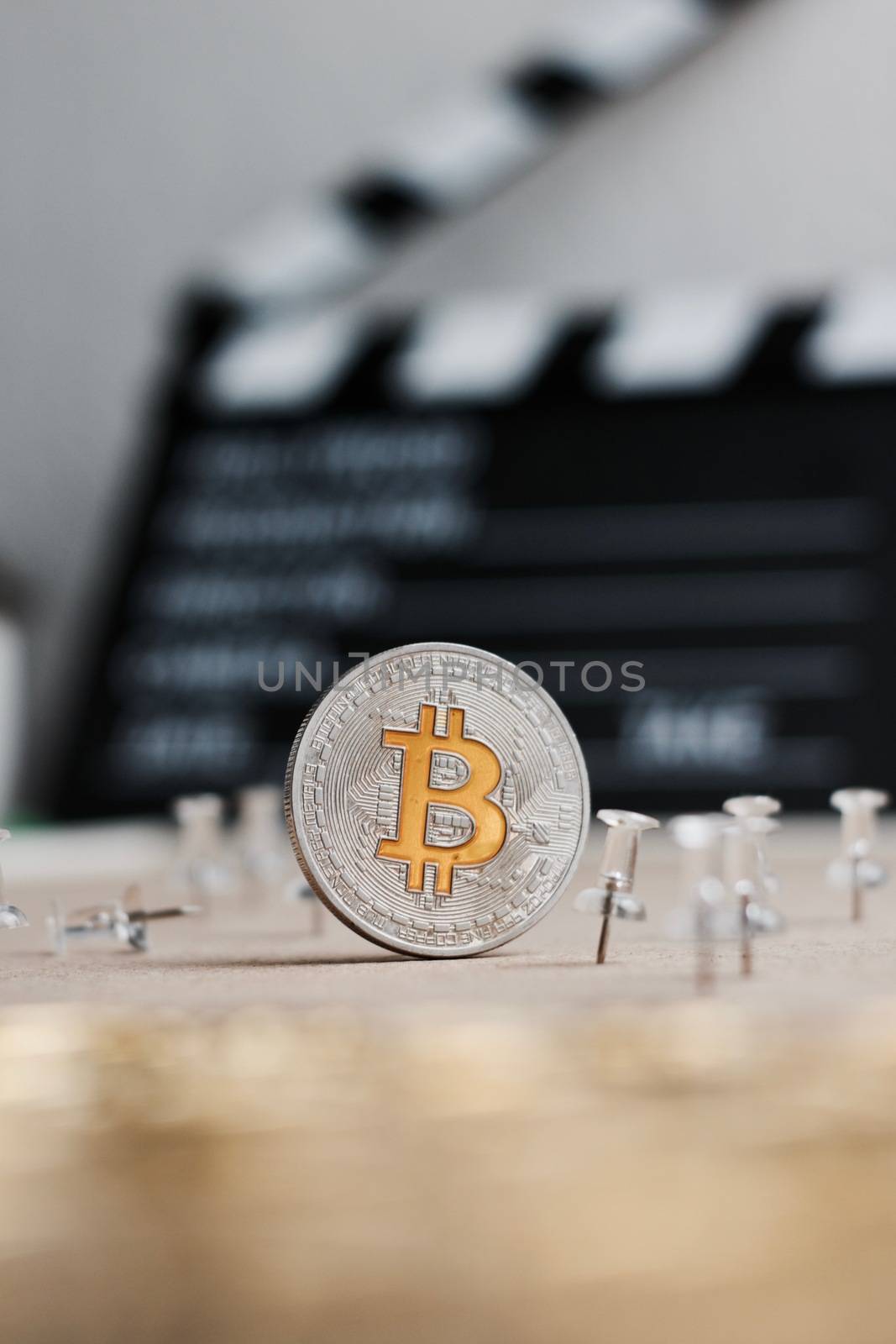 Digital currency physical metal bitcoin coin. Cryptocurrency cinema concept.
