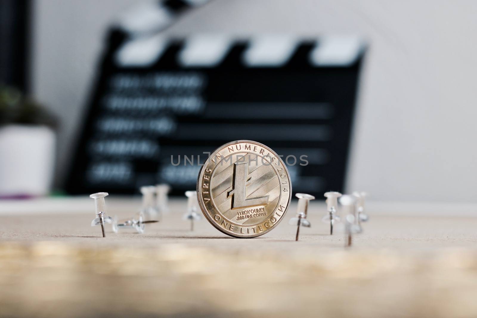 Digital currency physical metal litecoin coin. Cryptocurrency video concept.