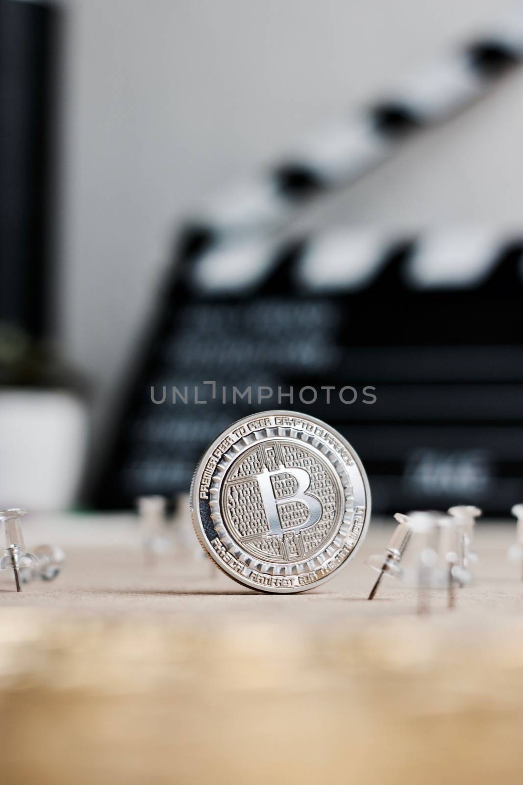 Digital currency physical metal bitcoin coin. Cryptocurrency cinema concept.