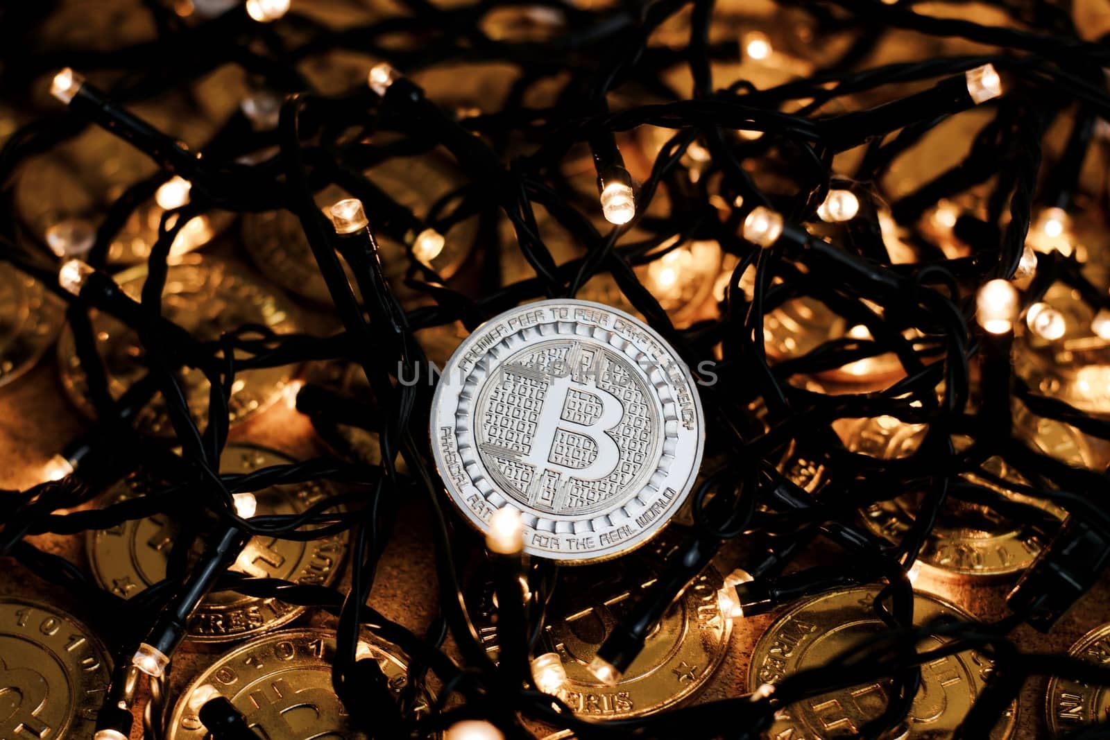 Digital currency physical metal bitcoin coin on the christmas concept.