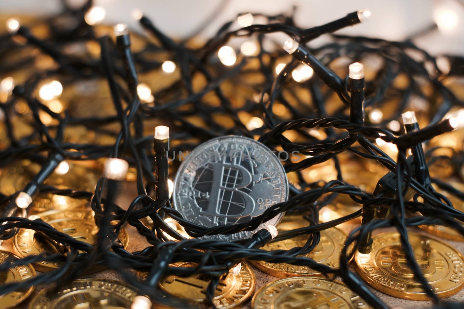 Digital currency physical metal bitcoin coin on the christmas concept.