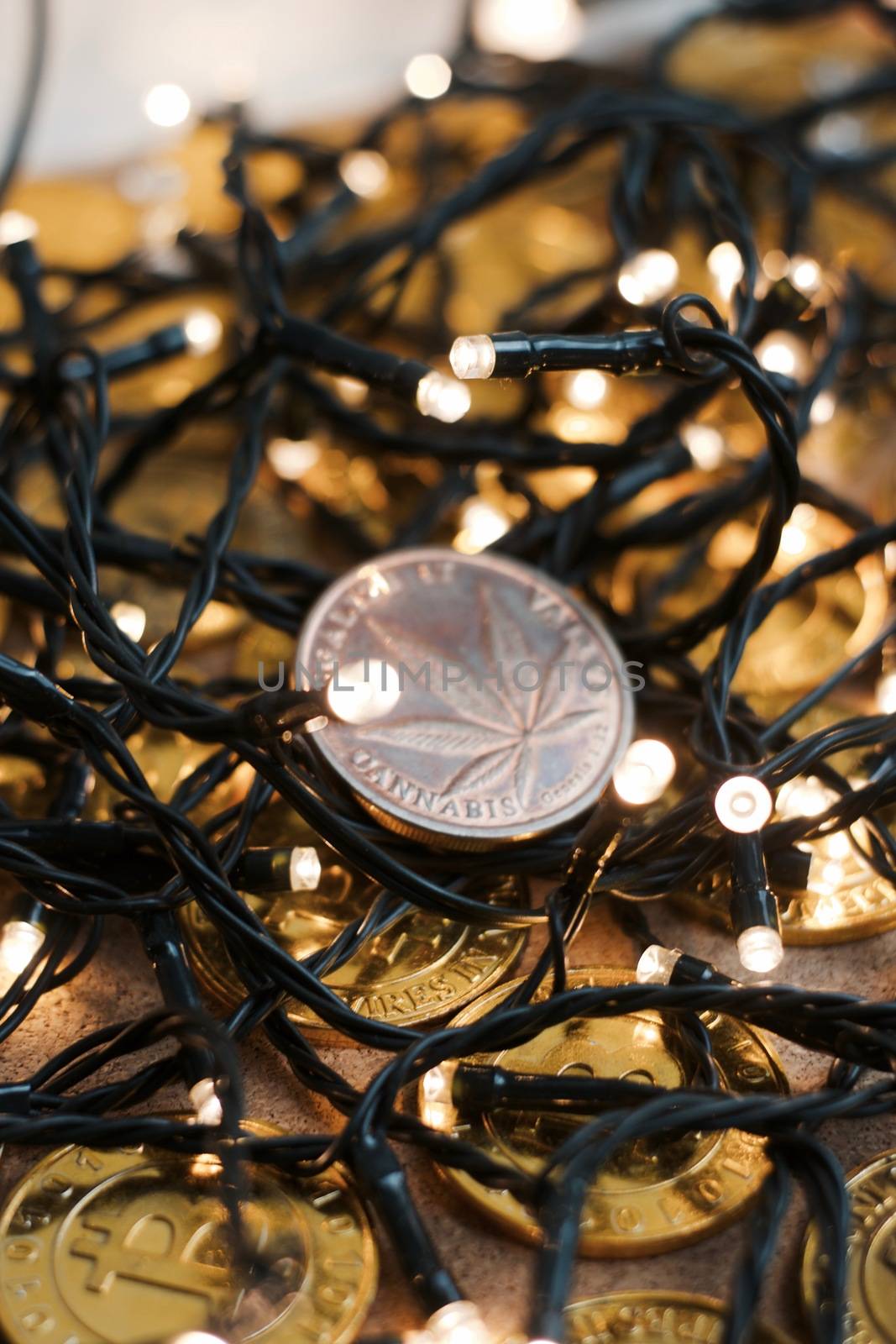 Brass physical marijuana coin. Christmas time sativa concept.