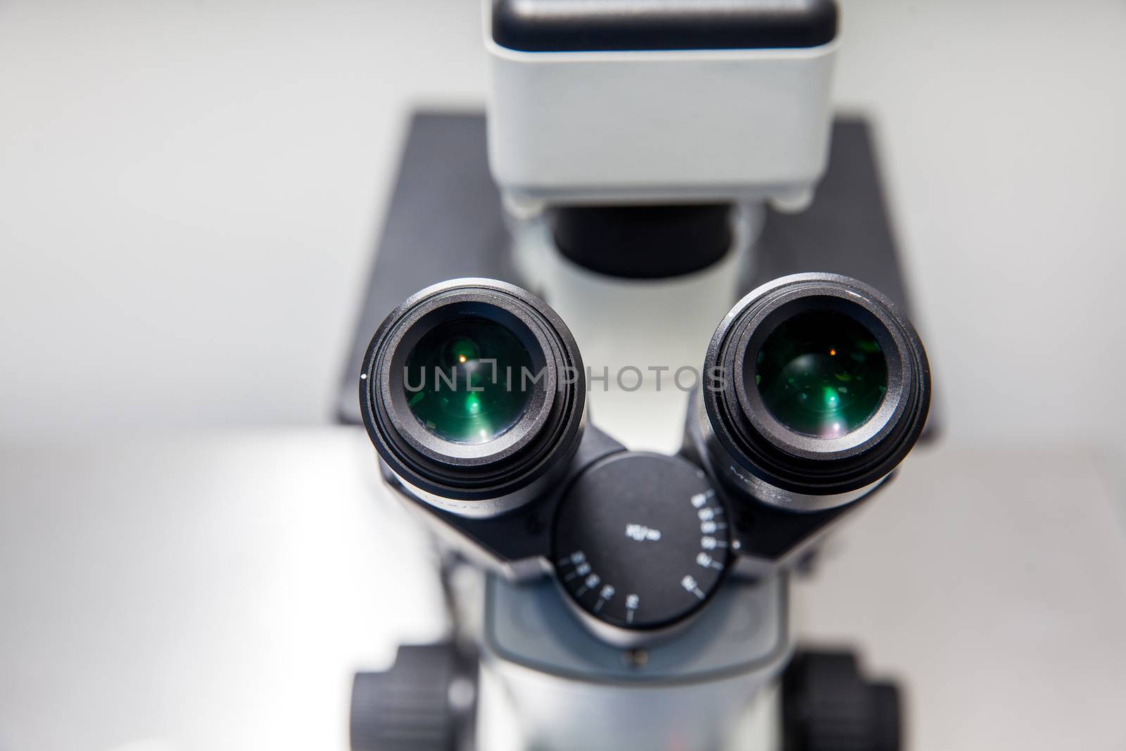 Close up of stereo microscope eyepieces in the laboratory