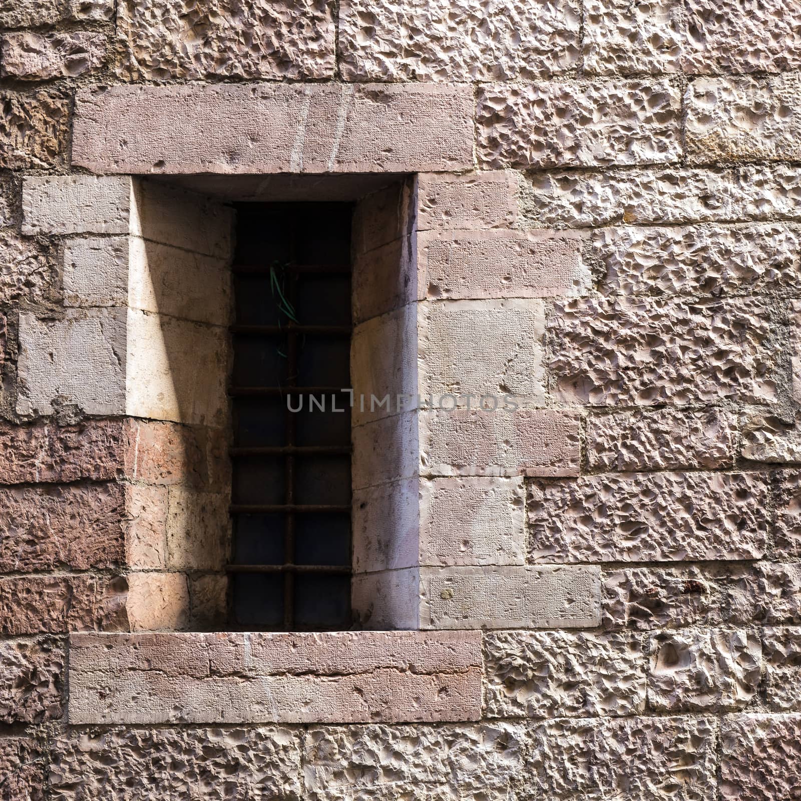 Assisi (Italy): Window on medieval stone wall