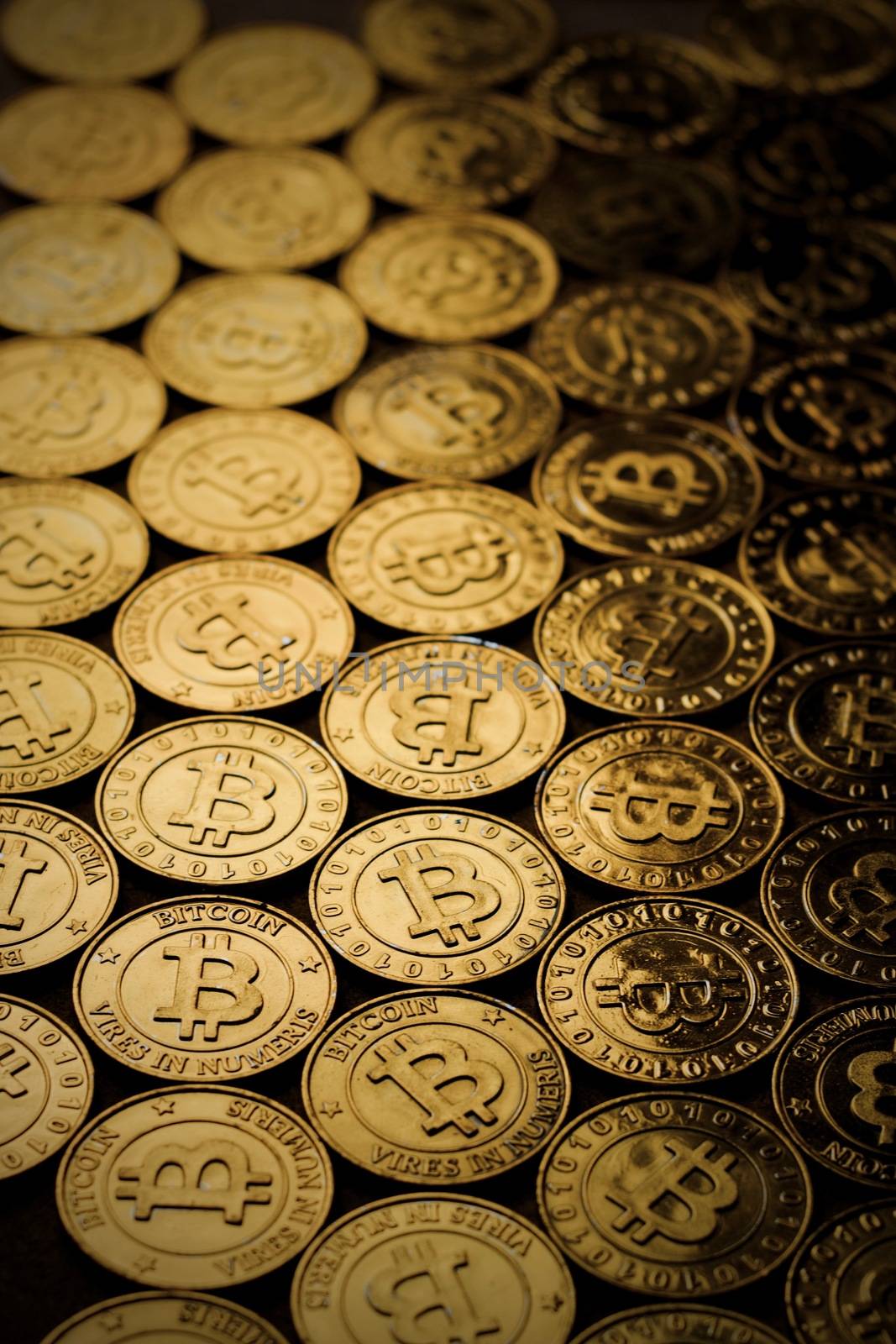 Digital currency physical gold bitcoin coin background. Cryptocurrency concept.