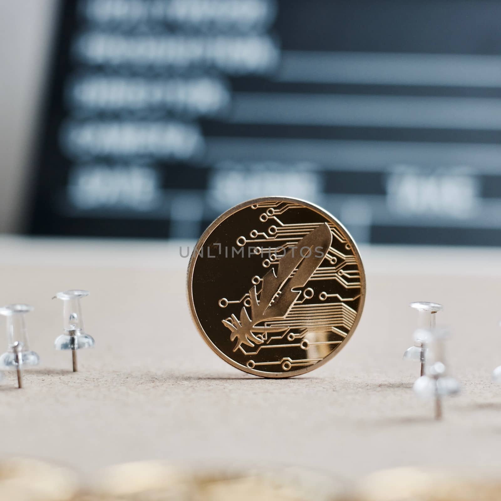 Digital currency physical gold feather coin. Cinema cryptocurrency concept.