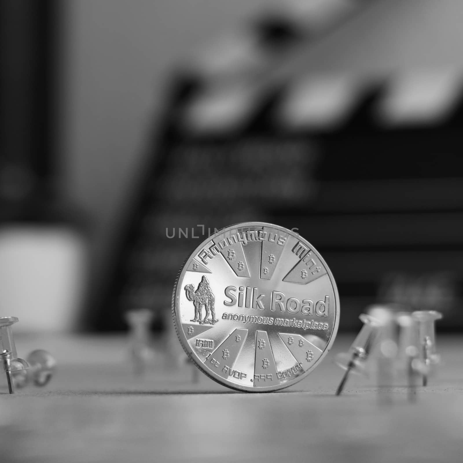 Digital currency physical metal bitcoin coin. Cryptocurrency cinema concept.