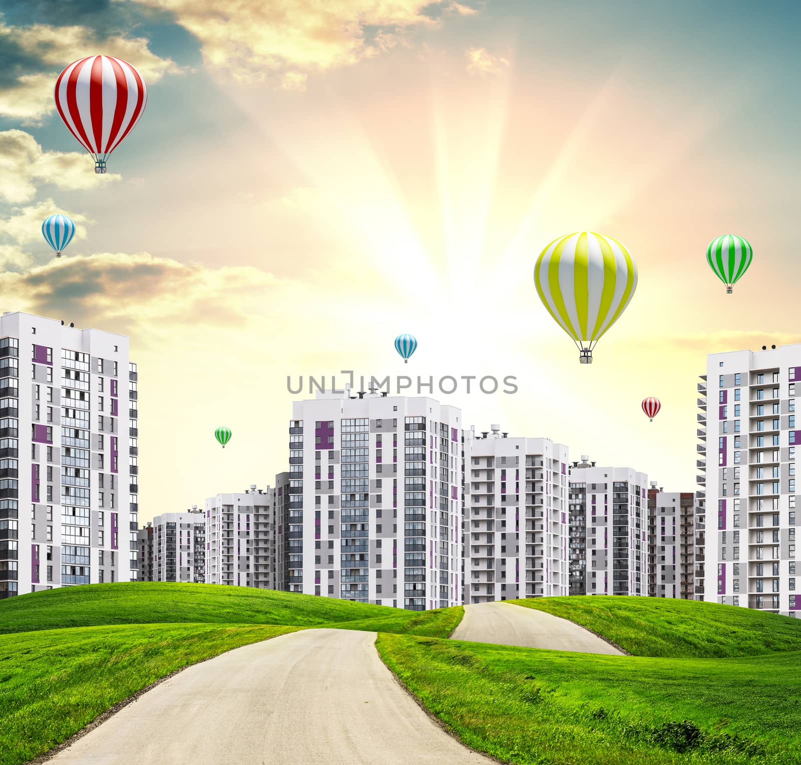 Urban road and buildings at sunset by cherezoff