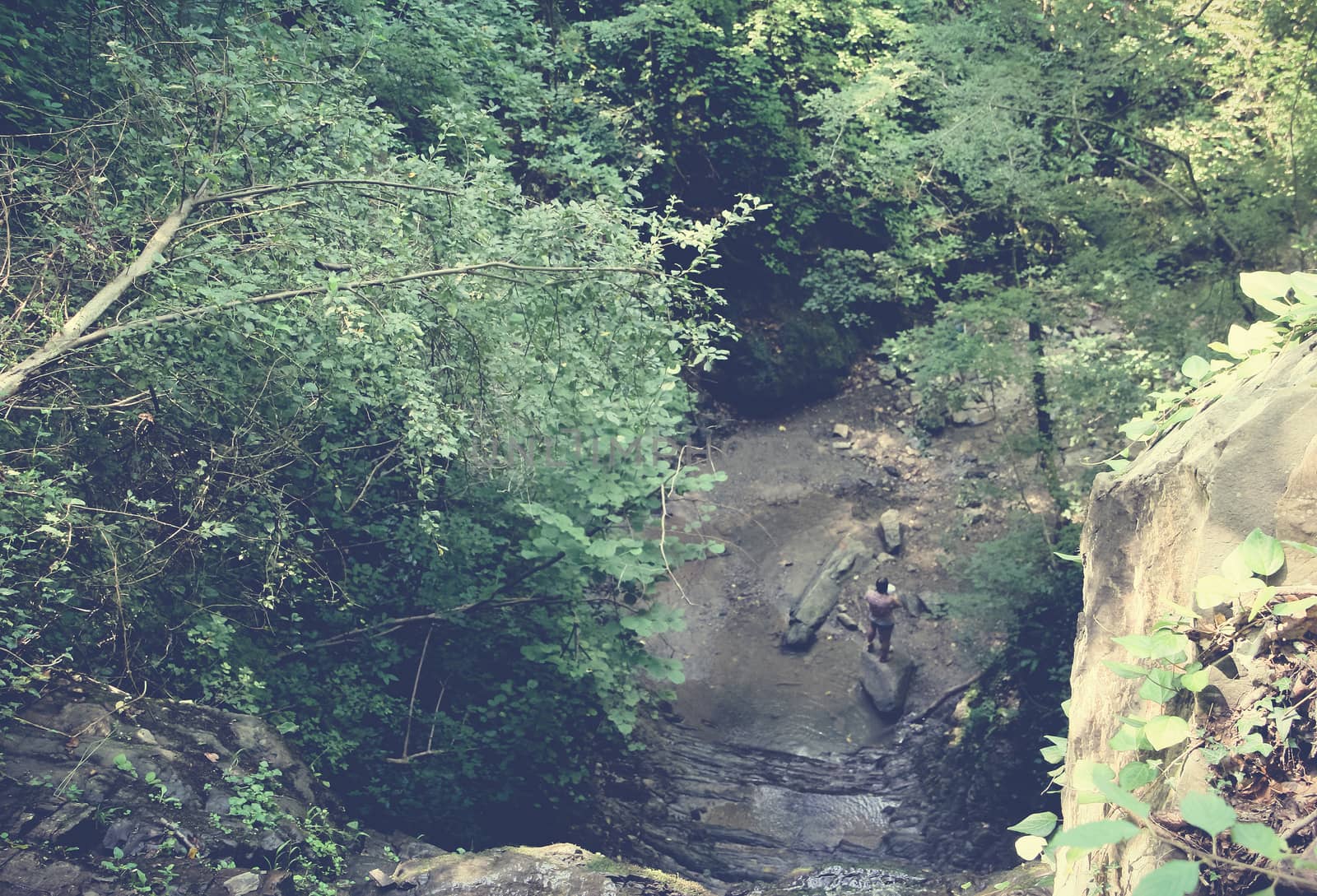 Man in the gorge of a mountain river.