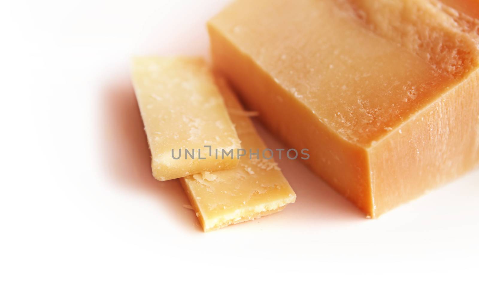 piece of Italian cheese parmesan on white background