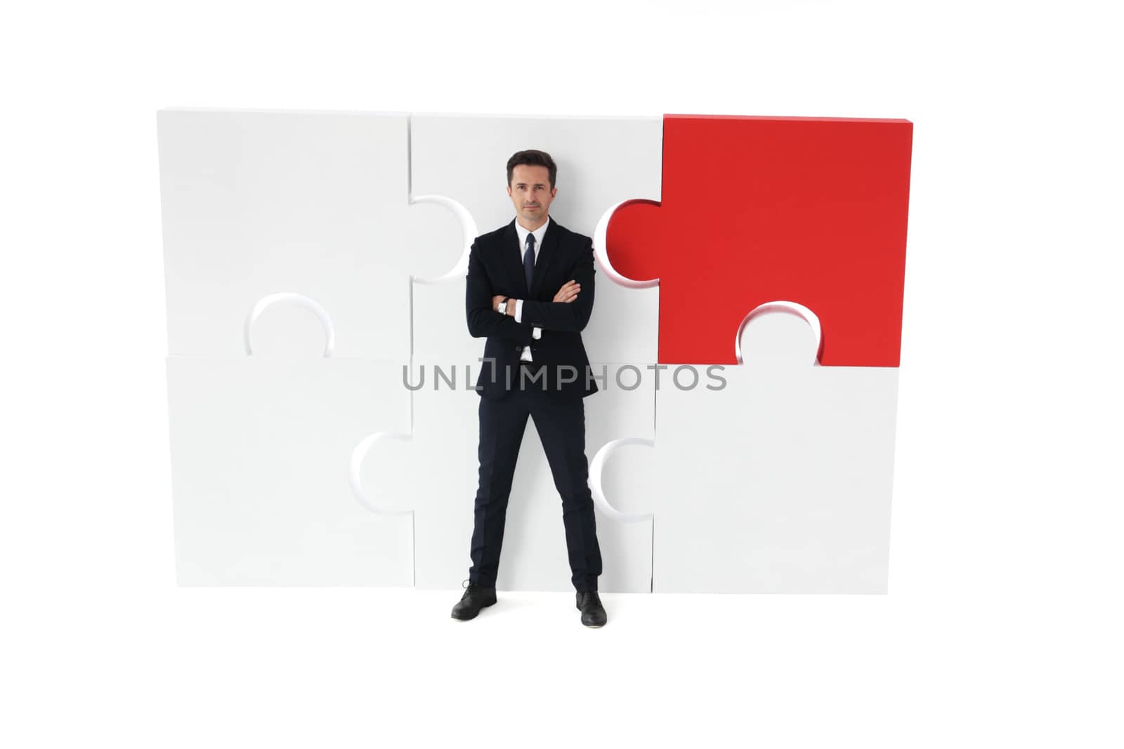 Business man and big puzzle by ALotOfPeople