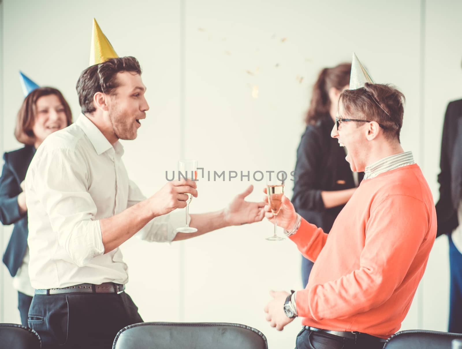 Business people celebrating New Year at office party