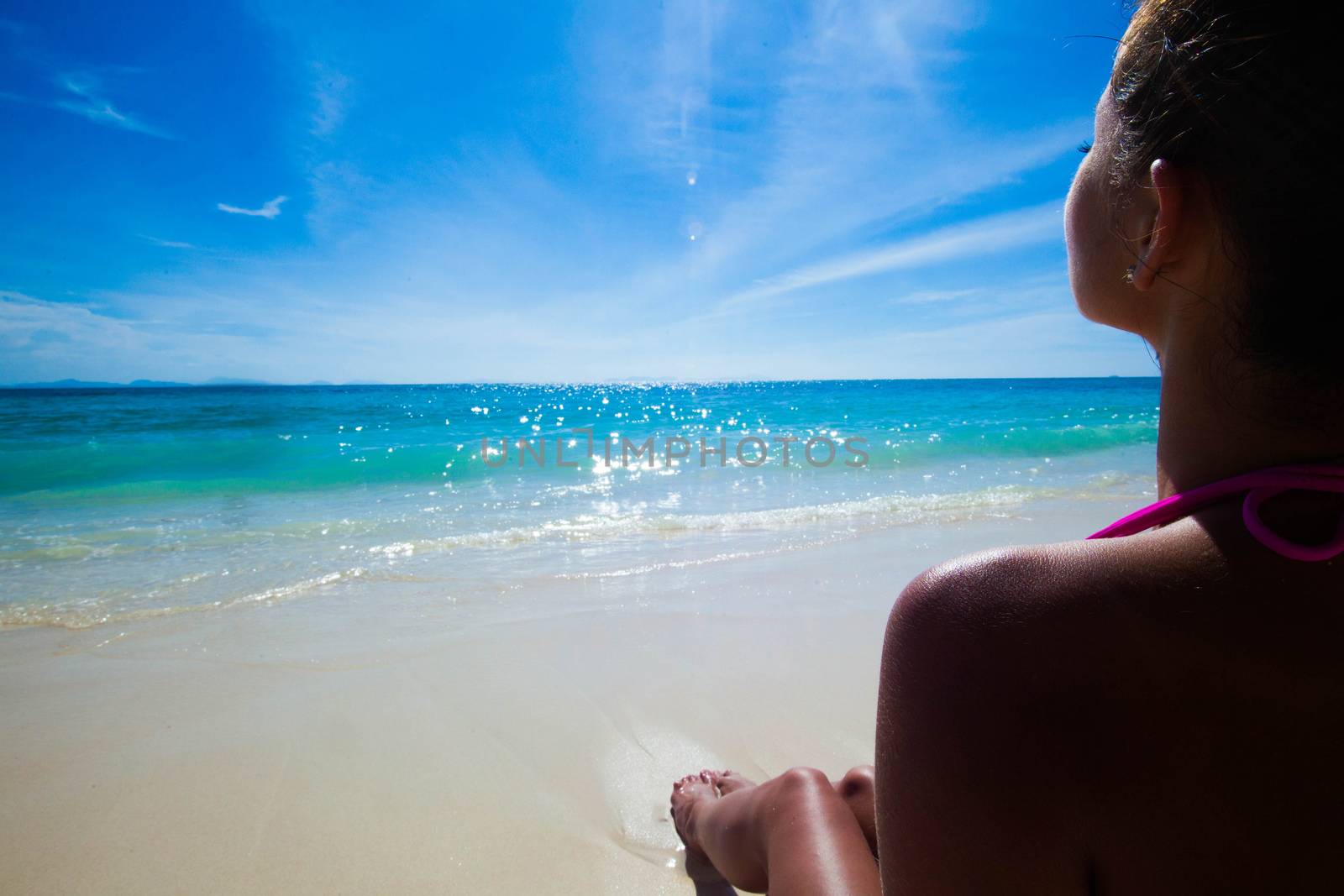 Young beautiful sexy woman relaxing on the beach