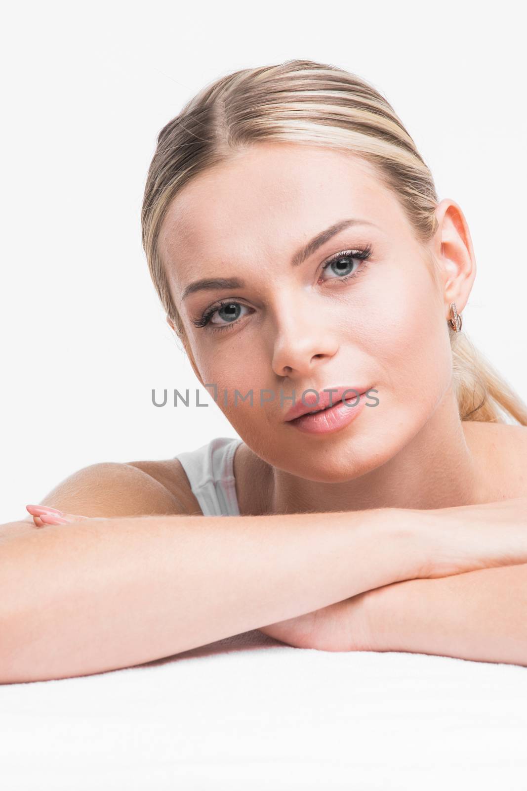 Portrait of young woman with perfect skin isolated on white background