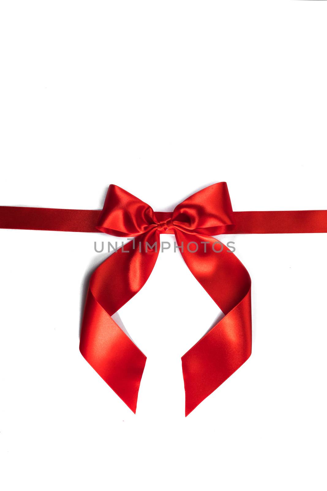 Red gift bow isolated on white background