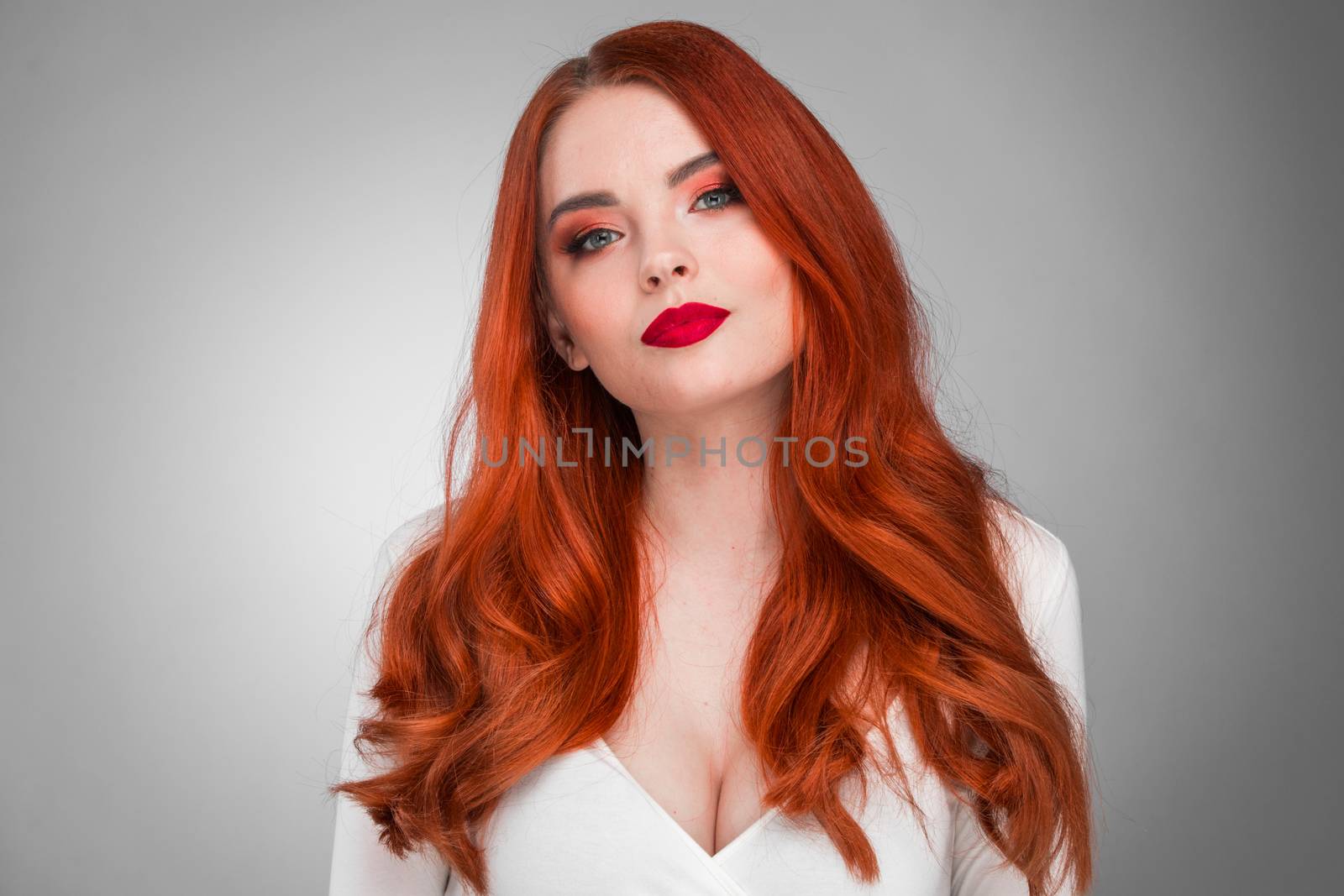 Photoshot of gorgeous redhead girl with bright makeup