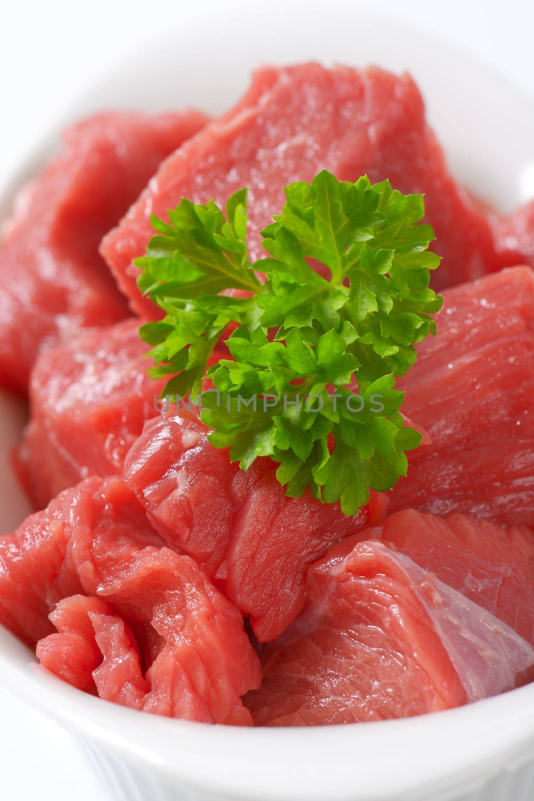 bowl of diced raw beef meat - close up
