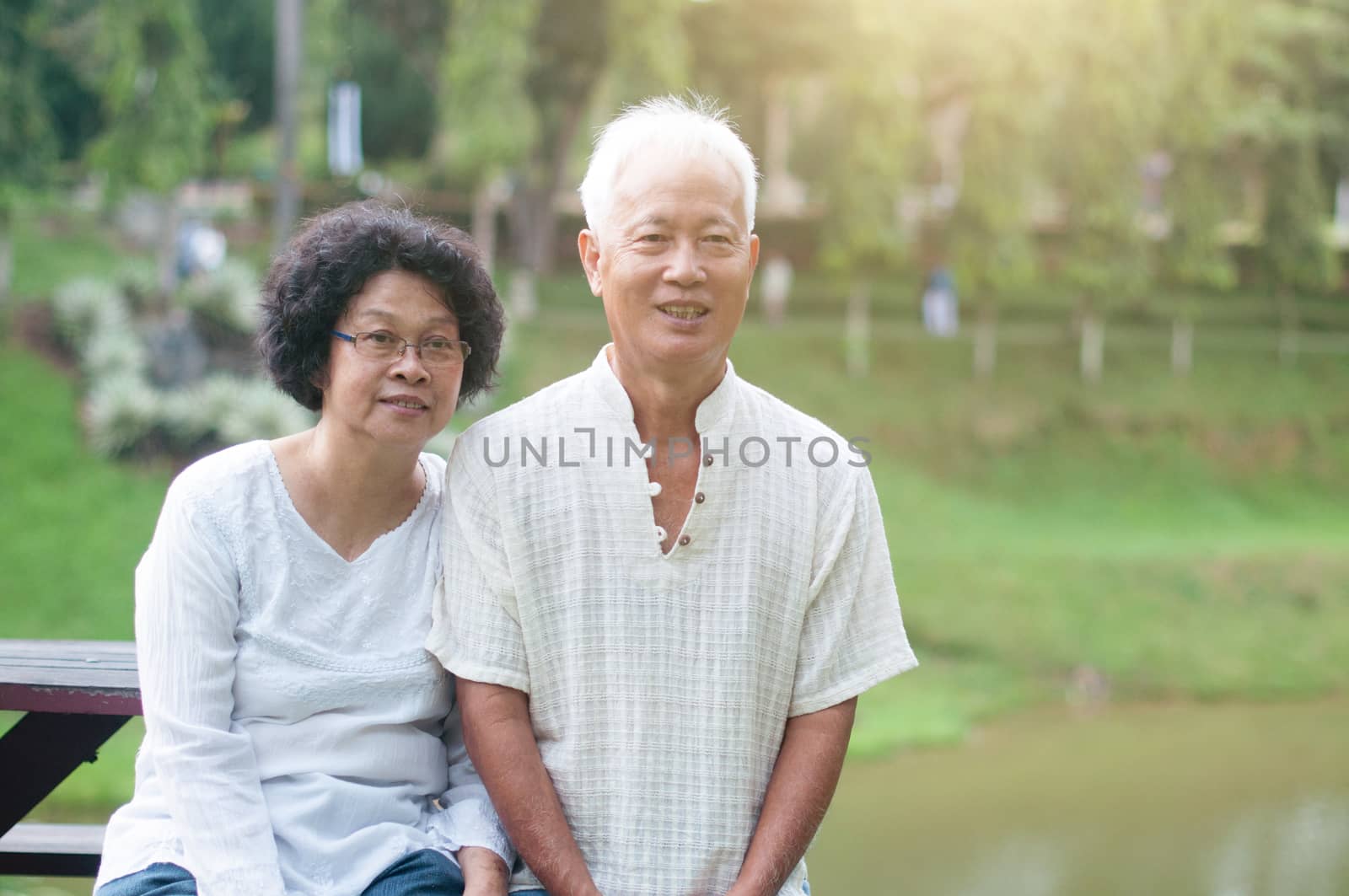 Portrait of mature couple relaxing at outdoor park