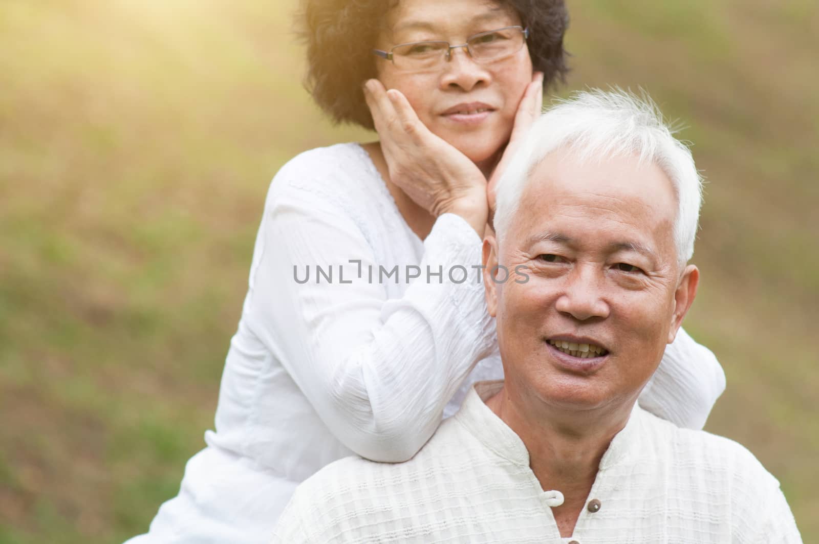 Old Asian couple smiling outdoor. by szefei