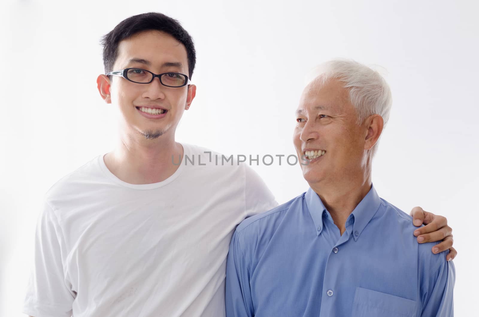 Asian old father and son smiling,  standing isolated on white background.