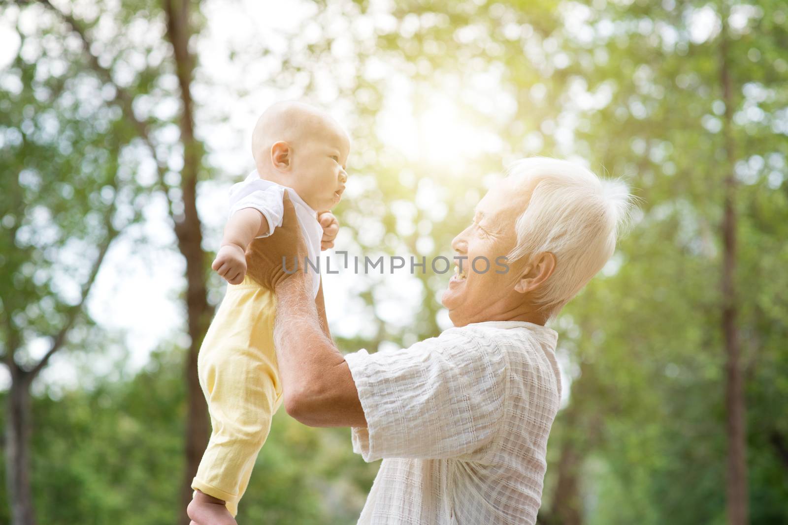 Grandparent holding grandchild. by szefei