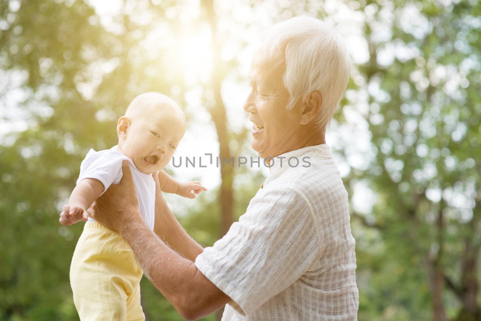 Grandparent and grandchild smiling. by szefei