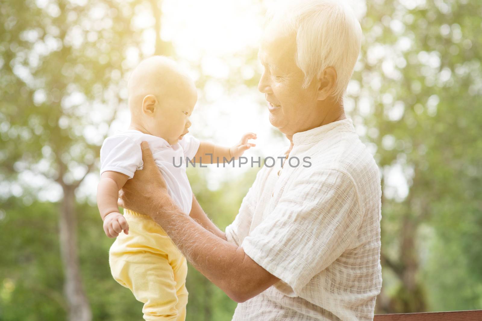 Grandfather with grandson at outdoors. by szefei