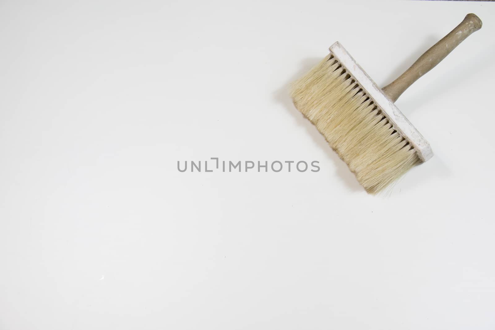 Roller and paint brush on a white background. Old painting tools