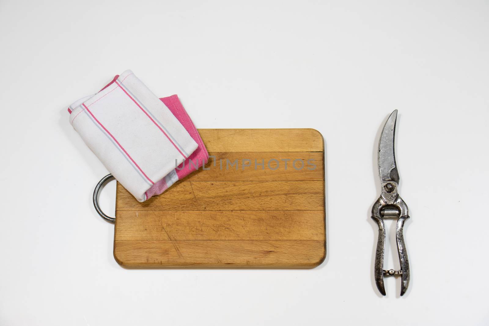 Old chopper and board, tools for butcher, white background.