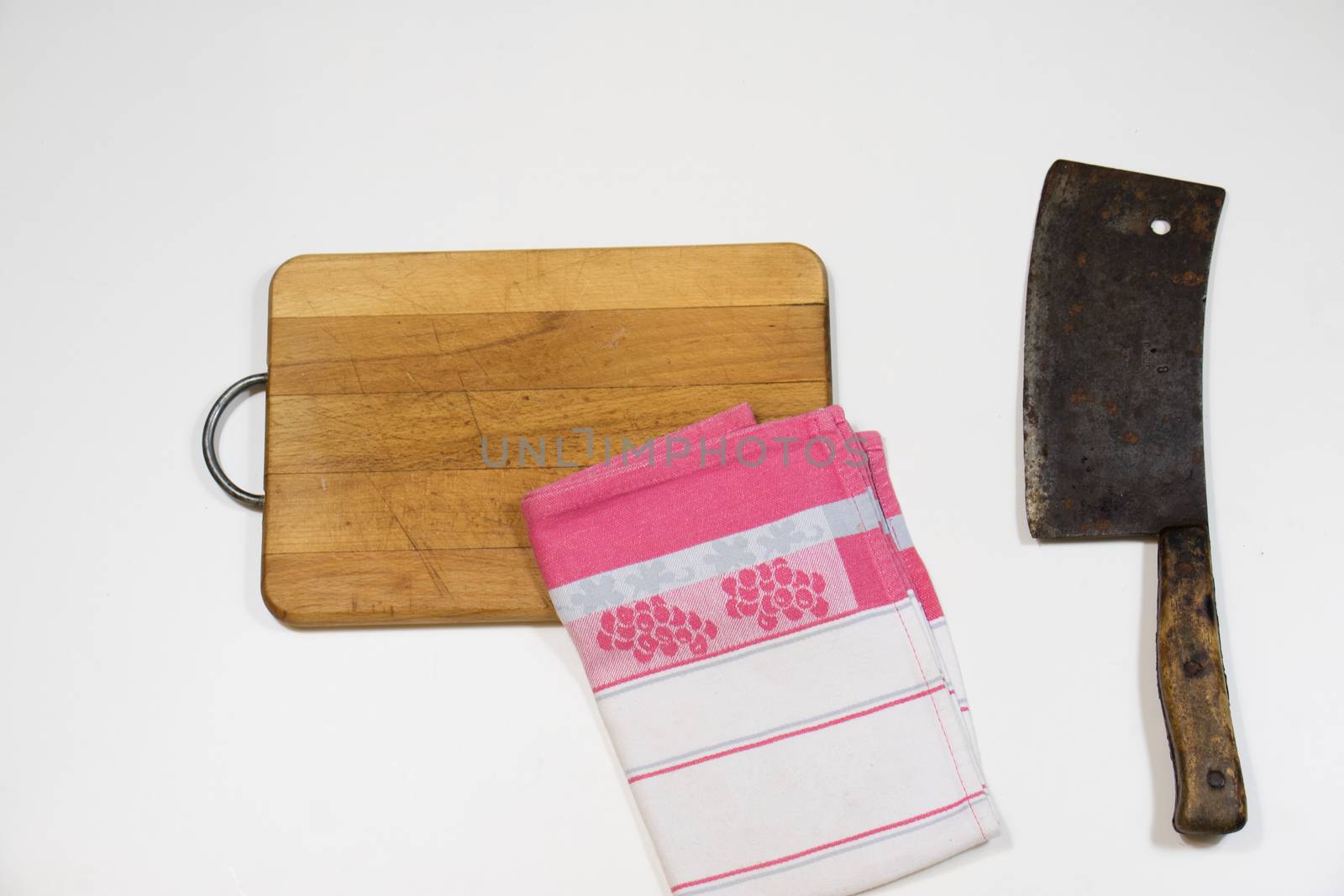 Old chopper and board, tools for butcher, white background.