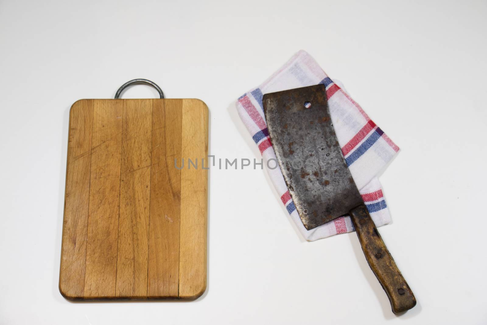 Old chopper and board, tools for butcher, white background.