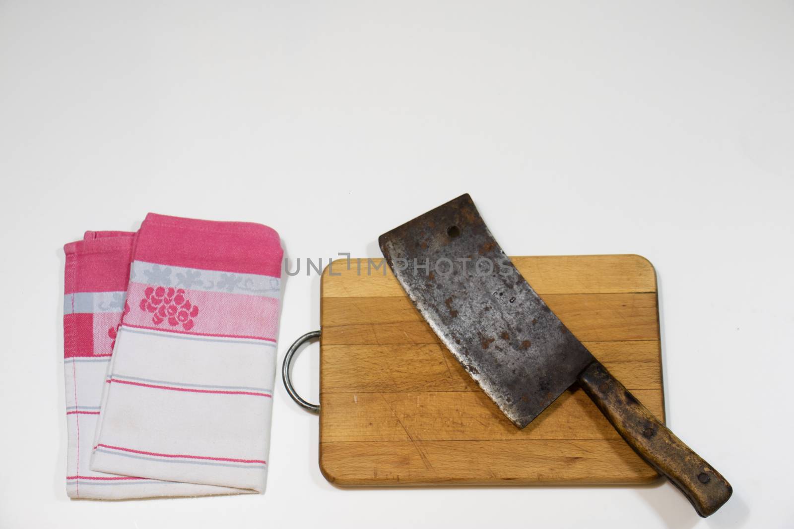 Old chopper and board, tools for butcher, white background.