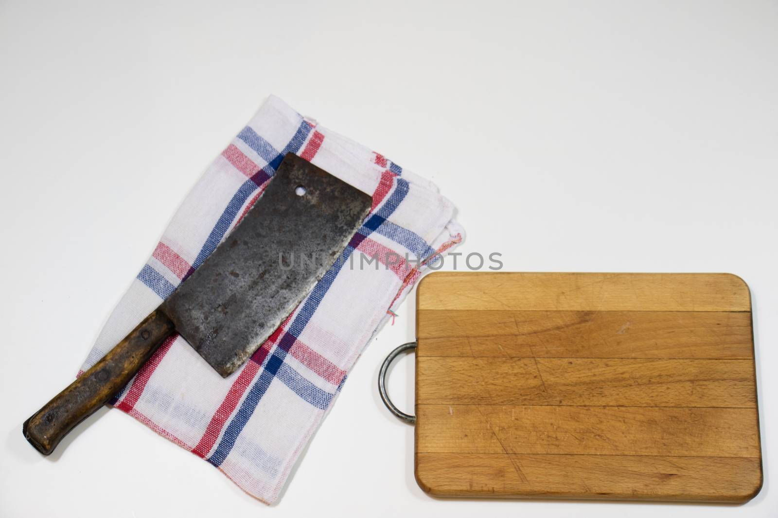 Old chopper and board, tools for butcher, white background.