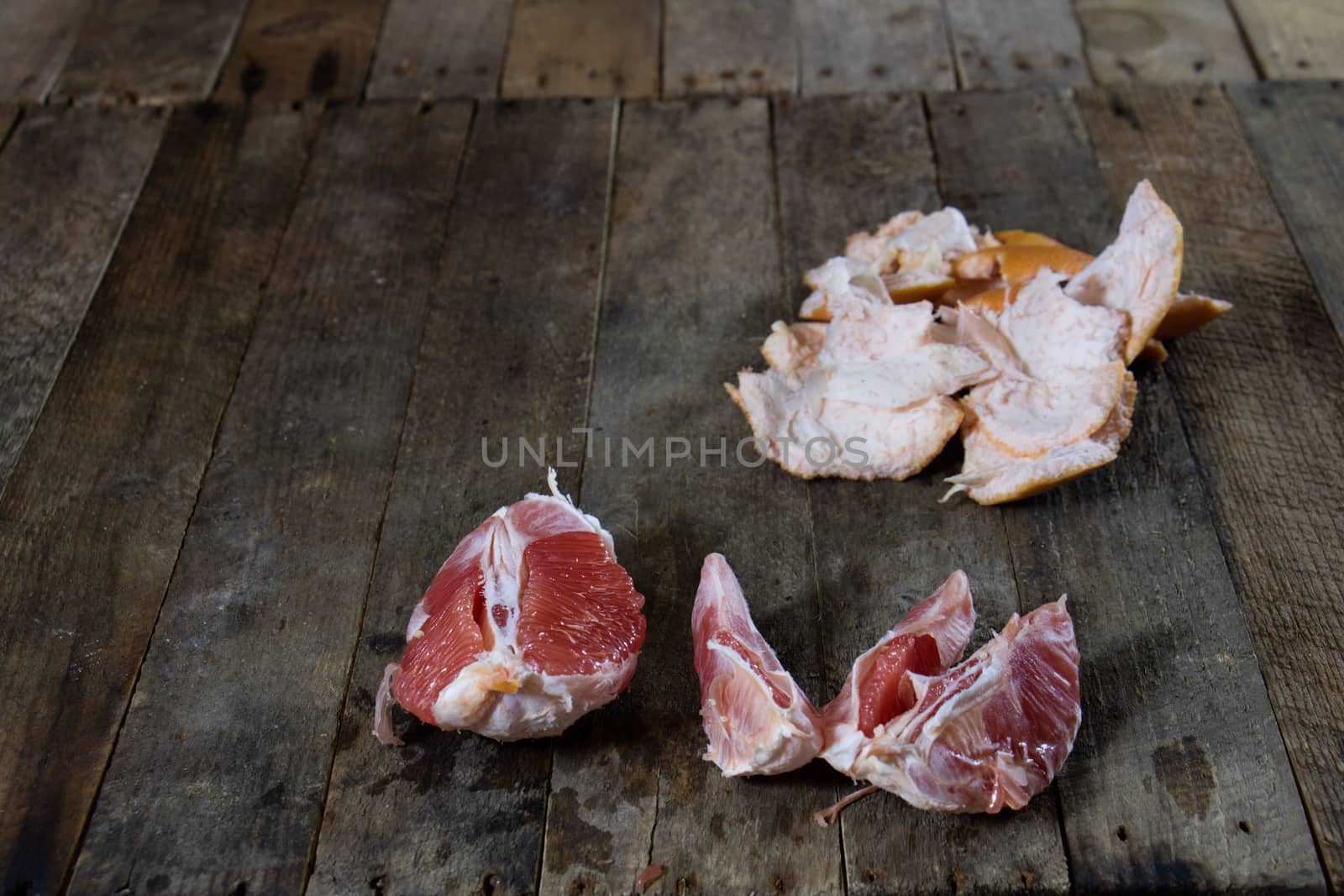 Picked grapefruit on a wooden table, juices and peaches, old kitchen