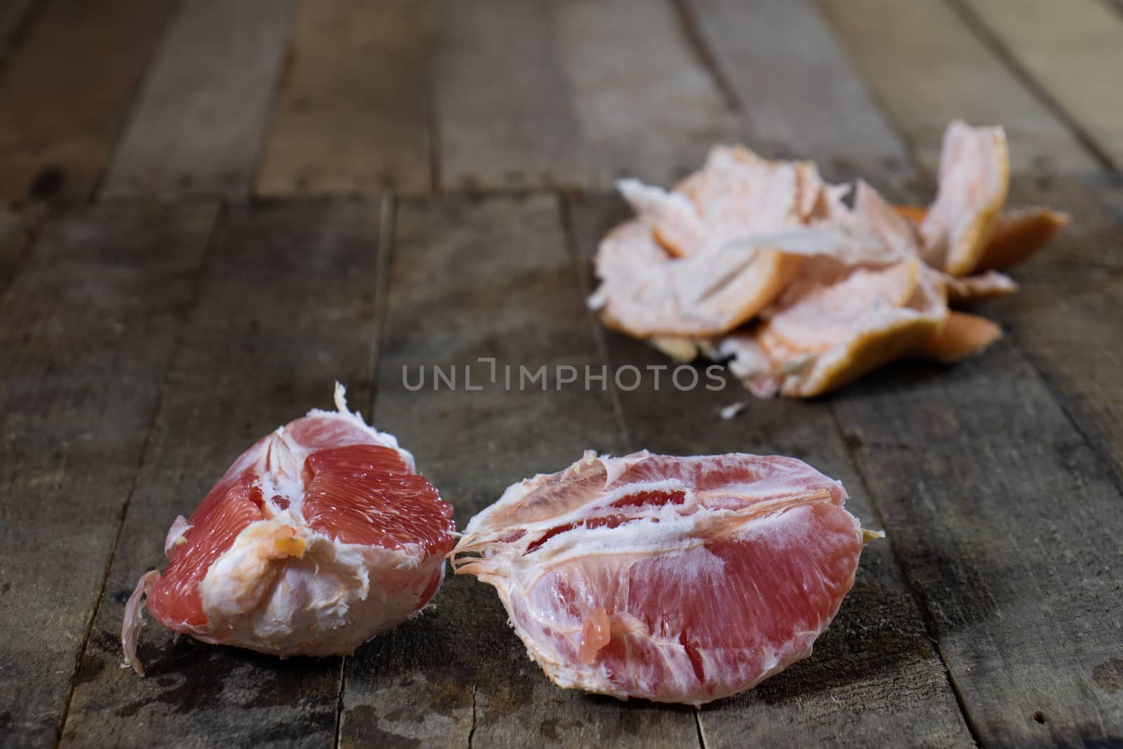 Picked grapefruit on a wooden table, juices and peaches, old kitchen