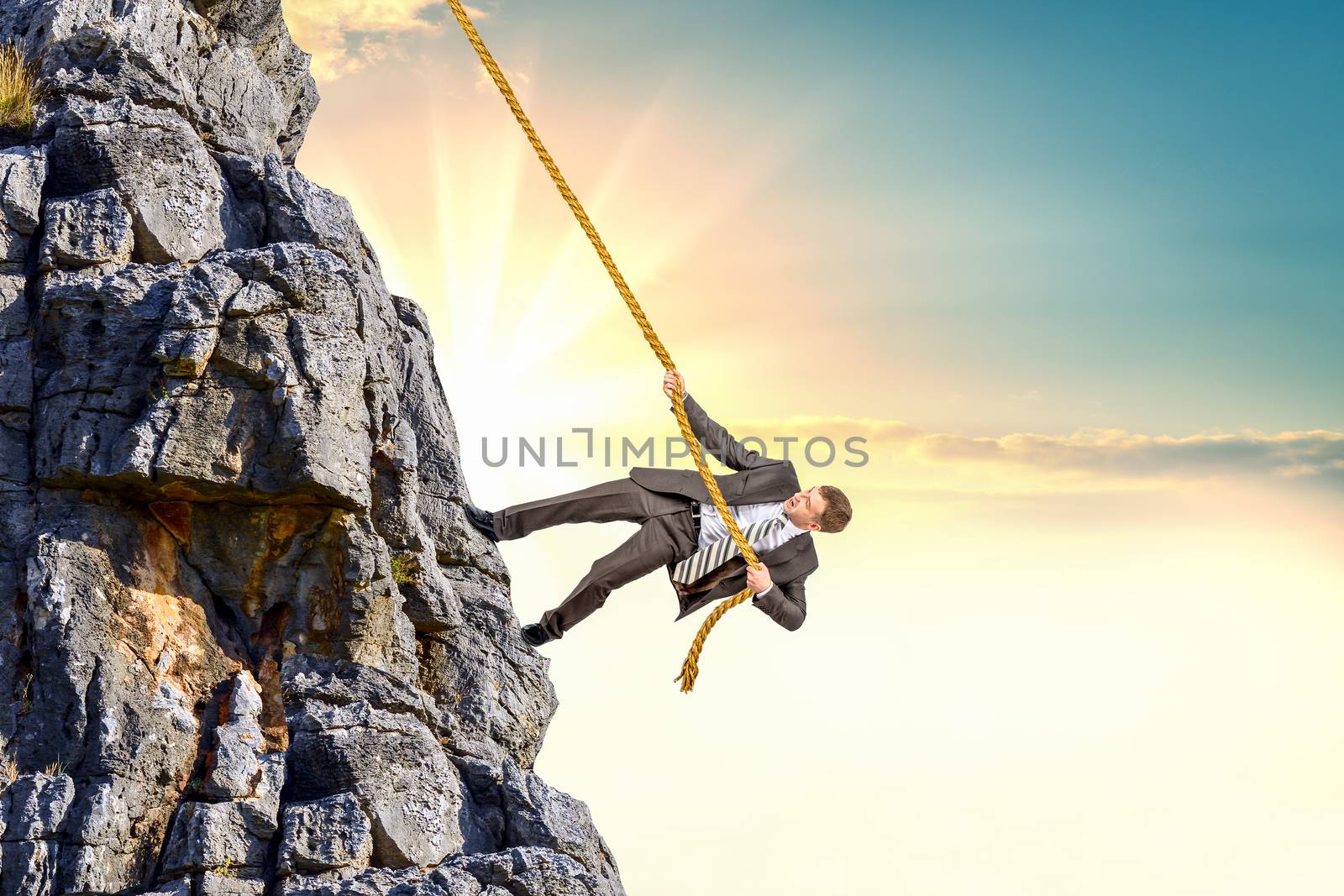 Businessman climb a mountain by cherezoff