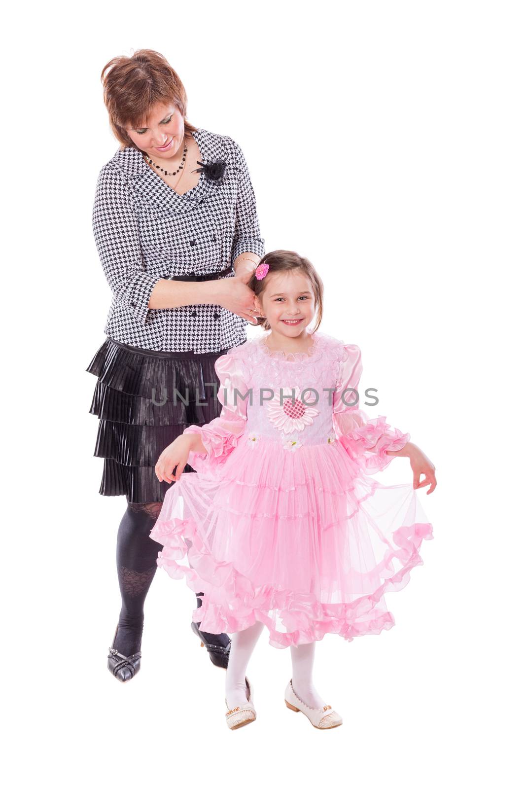 Mother making hair for daughter standing together isolated 