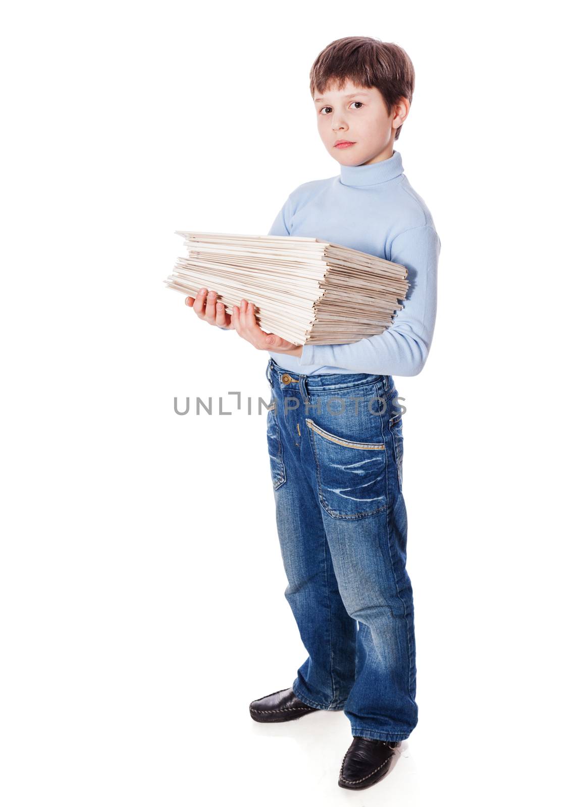 Serious upset schoolboy holding lots of papers isolated on white