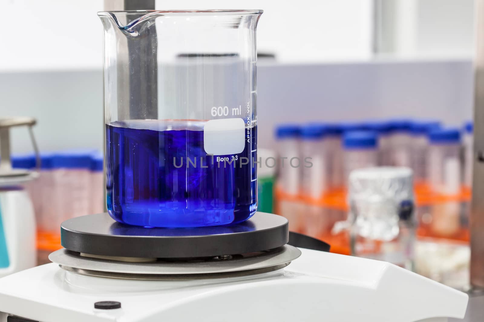 Glass beaker on top of a magnetic laboratory stirrer