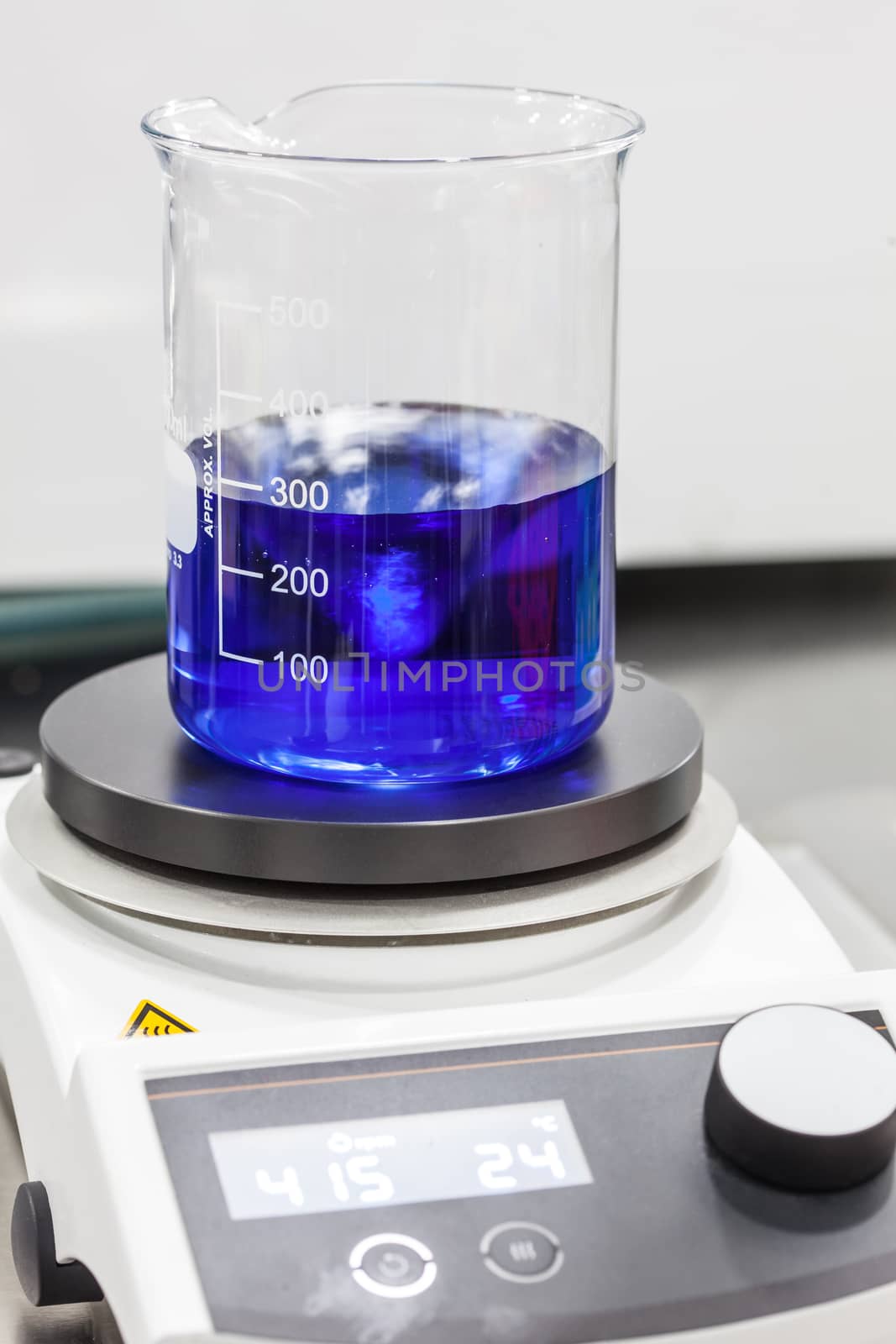 Glass beaker on top of a magnetic laboratory stirrer