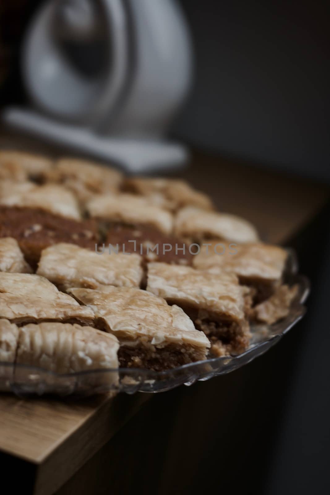 Tasty and sweet Turkish cookies on a transparent plate in room. Food concept.