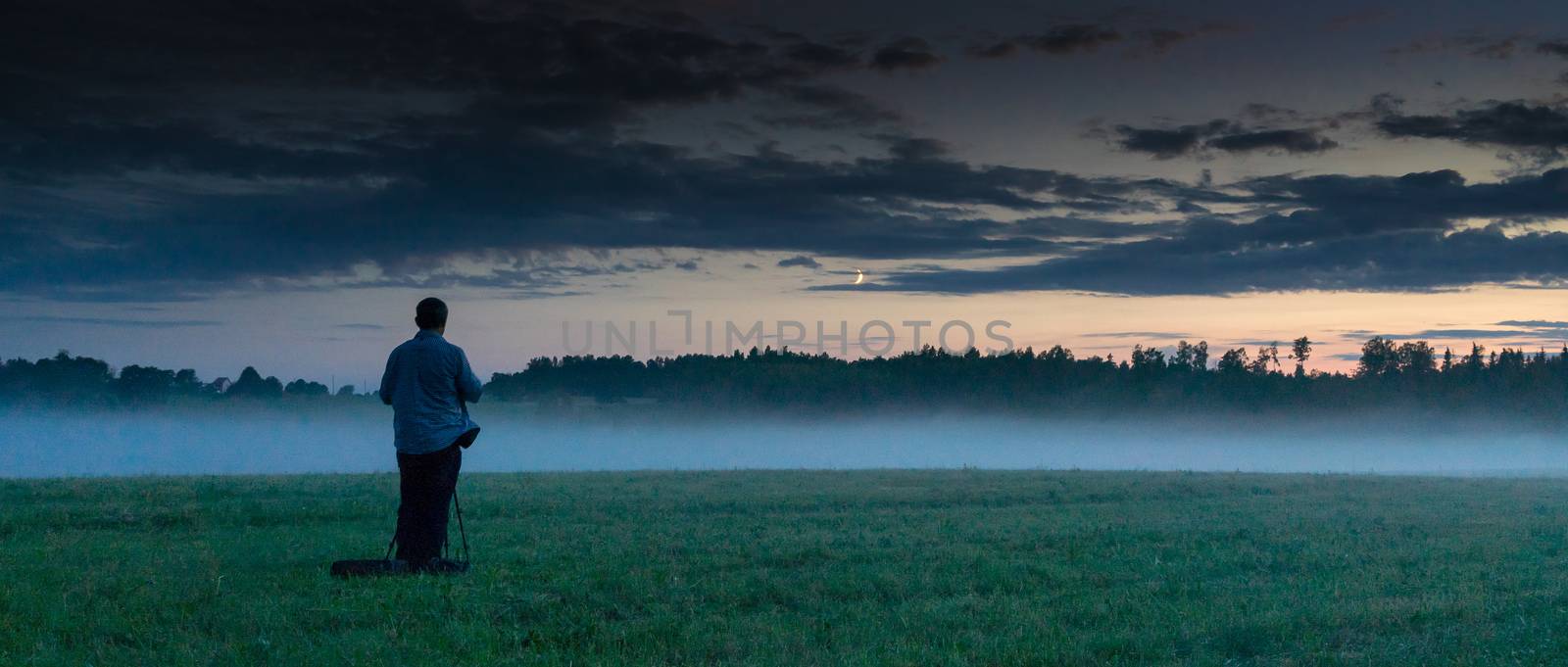 Latvian sunset of fog and blue sky - romantic evening