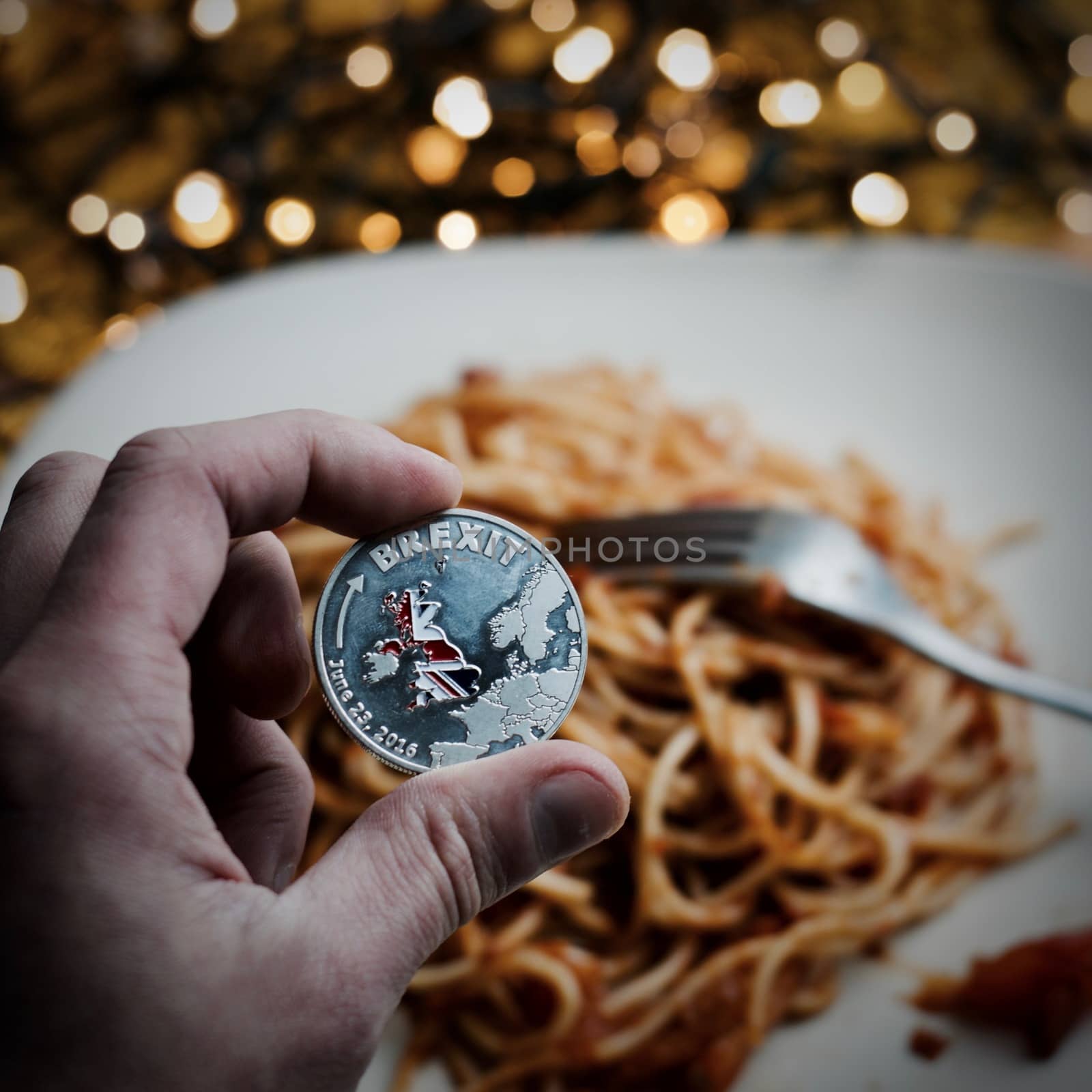 Silver physical brexit coin with british map. Italian pasta food concept.