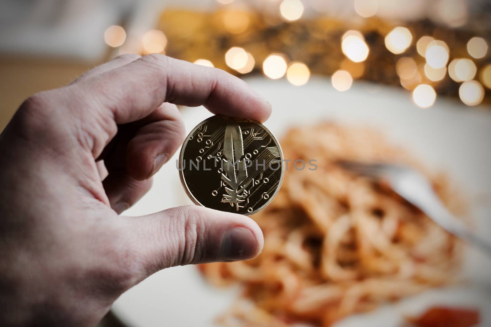 Digital currency physical gold feather coin. Italian pasta food concept.